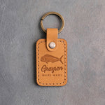 Indian summer leather keychain debossed with a mahi mahi above Grayson and MAHI MAHI, on gray plaster