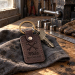 Mike Mechanic keychain in dark brown leather on a key ring hanging from a red rolling toolbox drawer