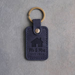 Blueberry navy leather keychain debossed with a gabled house above Mr & Mrs and EST 2026