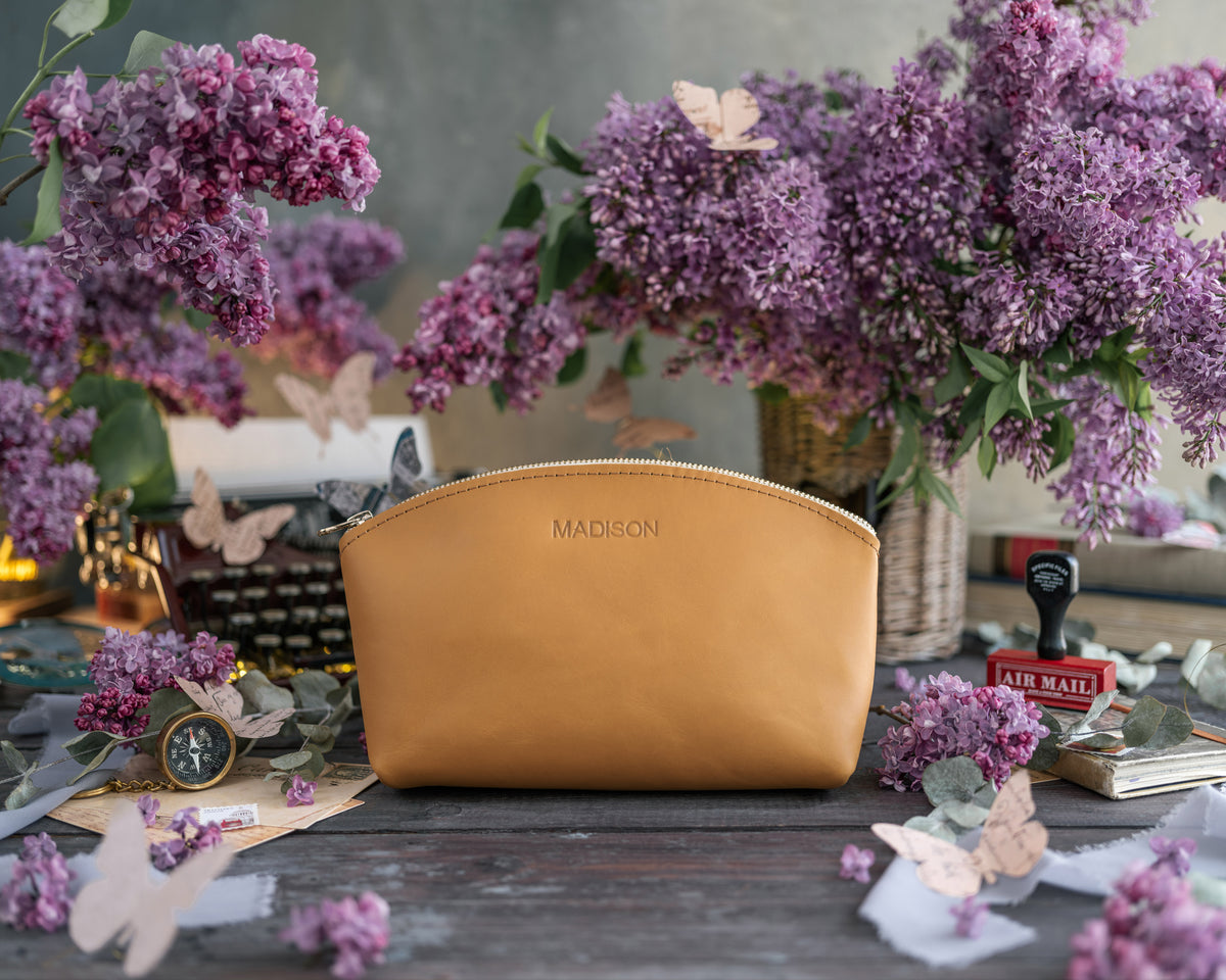 Indian summer leather makeup pouch personalized with the name Madison in gold, lilac blooms around