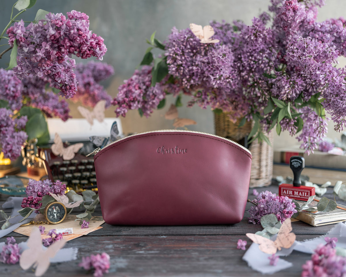 Makeup Bag In Sangria Leather with hand-finished detailing