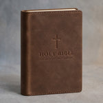 Sicilian Brown slip-on leather Bible cover debossed with a cross, HOLY BIBLE and a sample church name, on grey plaster