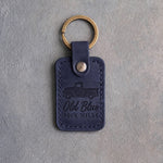 Blueberry navy leather keychain debossed with a classic pickup truck above Old Blue and 300K MILES