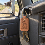 Caramel Points at Everything leather keychain placed in a warm everyday setting