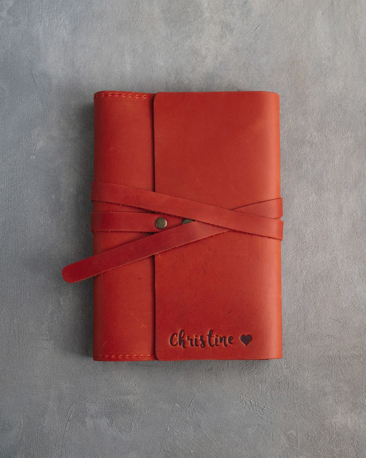 Poppy Red leather journal, Medium size, front with a debossed name