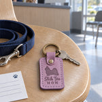 Lilac Shih Tzu Mom leather keychain placed in a warm everyday setting