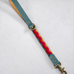 Short traffic dog leash in Summer Waves woven webbing with a sky blue leather handle