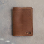 Sicilian Brown leather passport cover with the monogram GWH in straight capitals pressed into the bottom corner