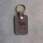 Country gray leather keychain debossed with a loafing cat above the name Oliver and TABBY CAT