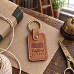 Caramel Taught me TO READ keychain on kraft paper beside a book half wrapped with cotton string