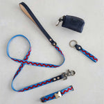 Thin webbing leash in blue ric rac with a matching collar, keychain and leather bag holder