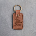 Caramel leather keychain debossed with a heavy round tomcat above the words Vet says BIG BONED