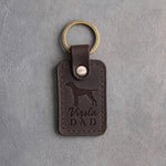 Dark espresso leather keychain debossed with a vizsla silhouette and Vizsla DAD on gray concrete