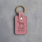 Parisian Blossom pink leather keychain with a debossed vizsla and the words Vizsla MOM, on gray concrete