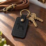Black Wet Beard Kisses leather keychain placed in a warm everyday setting