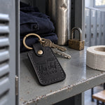 Yes Chef Heard keychain in black leather on a ring of restaurant keys beside a ticket rail after service