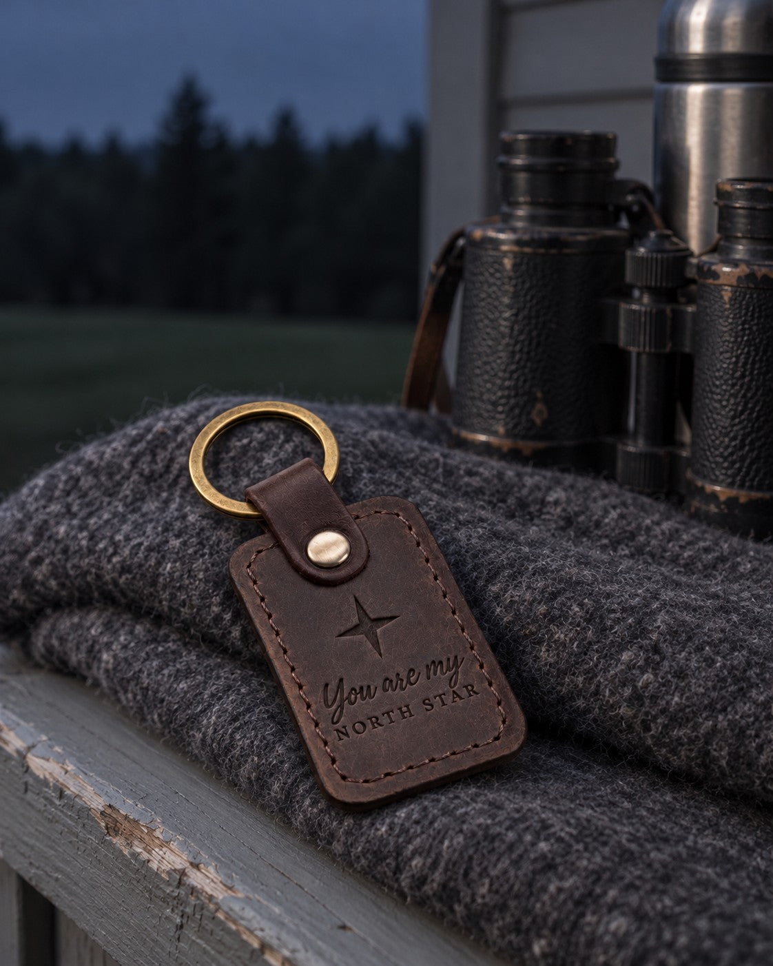 Dark brown North Star keychain on truck keys resting on a folded road map in late afternoon light