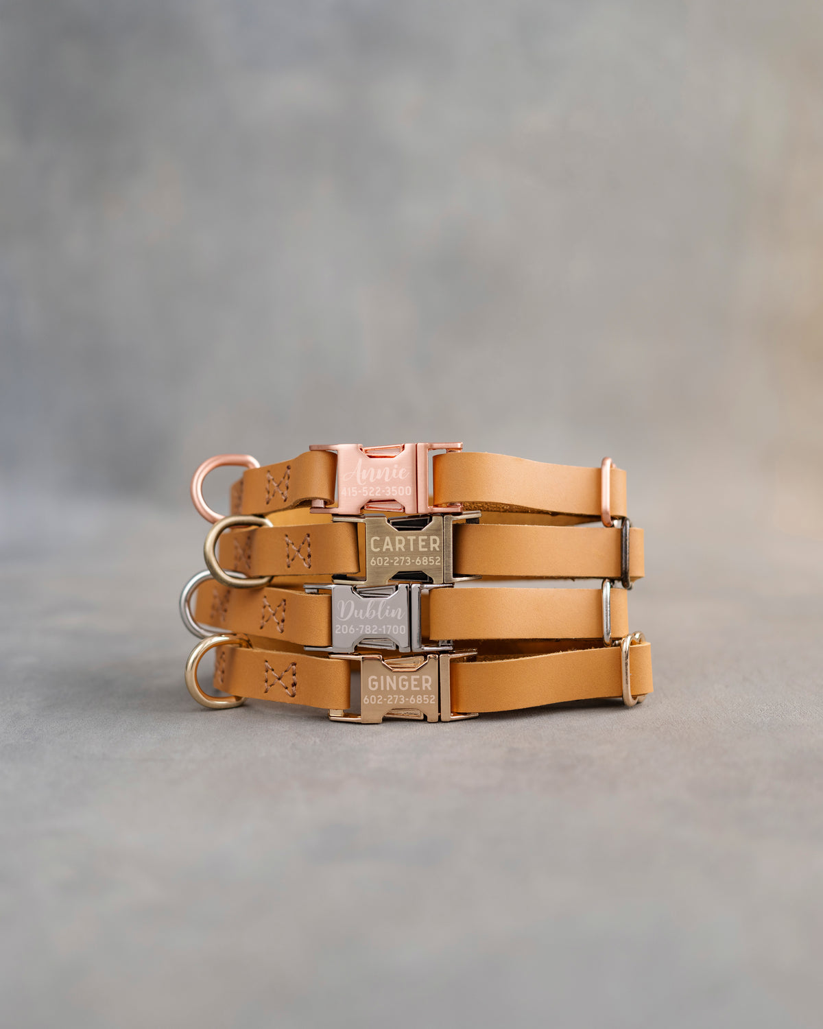 Orange dog collars in Indian Summer full-grain leather, 5/8 in wide, with engraved quick release buckles in four finishes